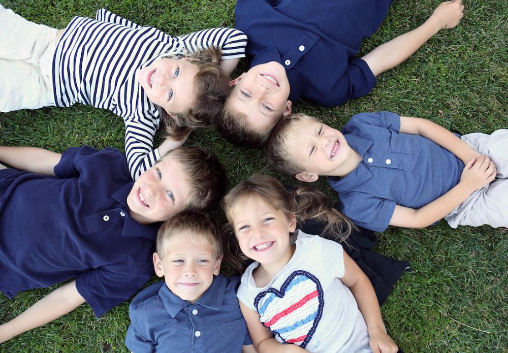kid's dentist rockville | group of boys lying on grass