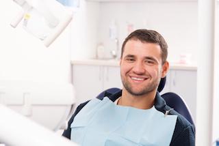 Patient smiling in treatment chair for dental fillings in Rockville, MD