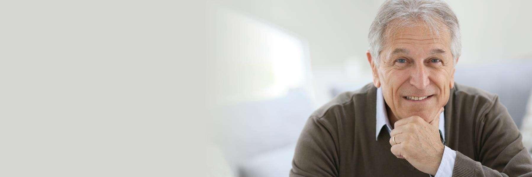 Man with dental crowns smiling at dentist in Rockville, MD