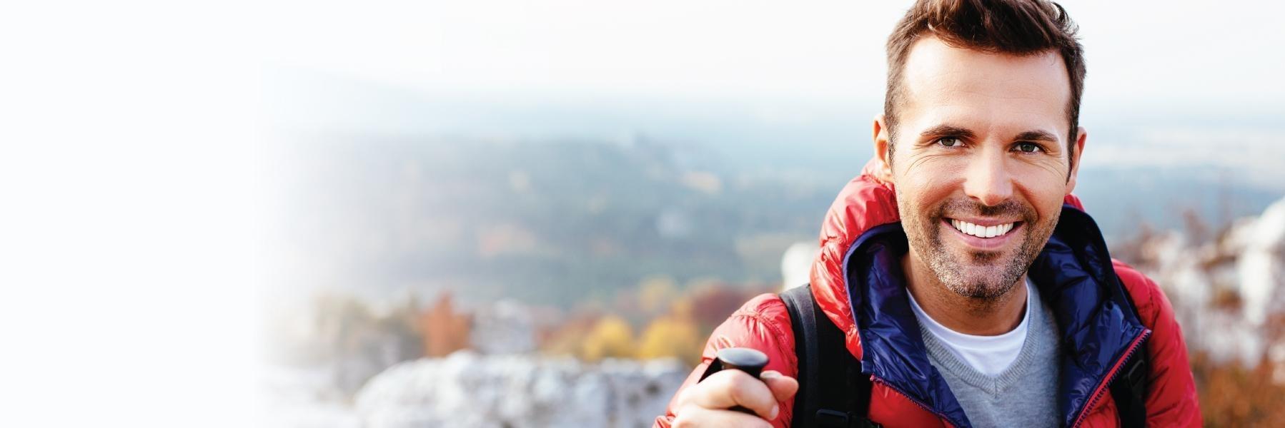Man smiling on a hike at Rock Creek Regional Park in Derwood, MD