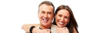 Couple wearing Invisalign aligners in Rockville, MD