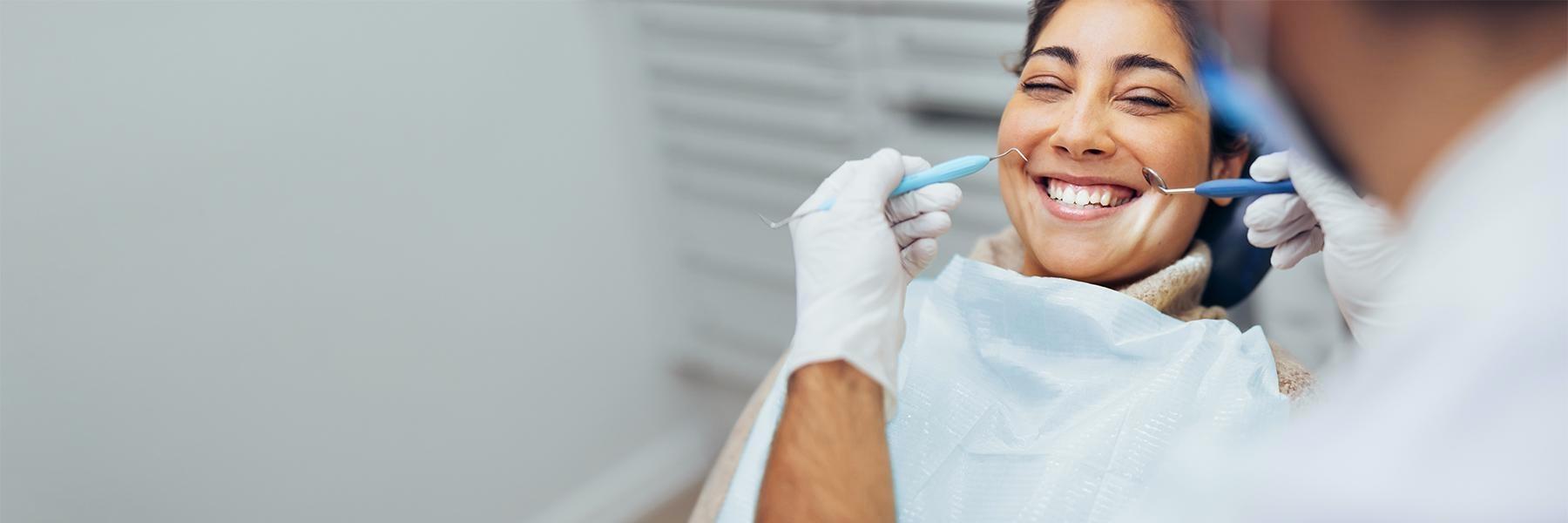Patient smiling in treatment chair at dentist in Rockville