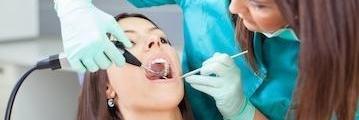 Woman getting dental implant in Rockville, MD