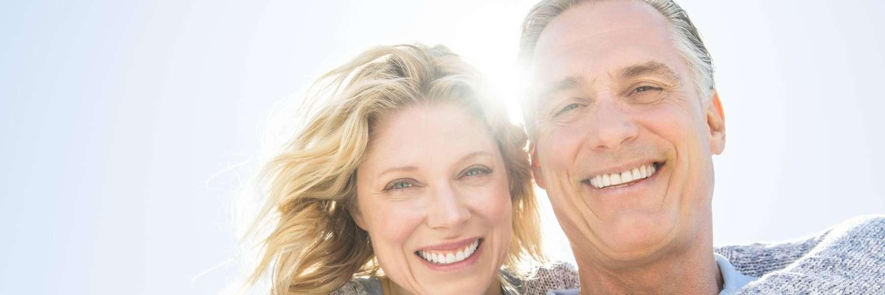 Couple smiling outside at Fallsgrove Stream Valley Park in Rockville, MD