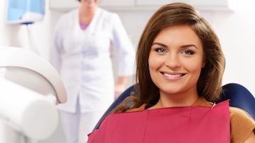 Dental patient in Rockville sitting in chair smiling