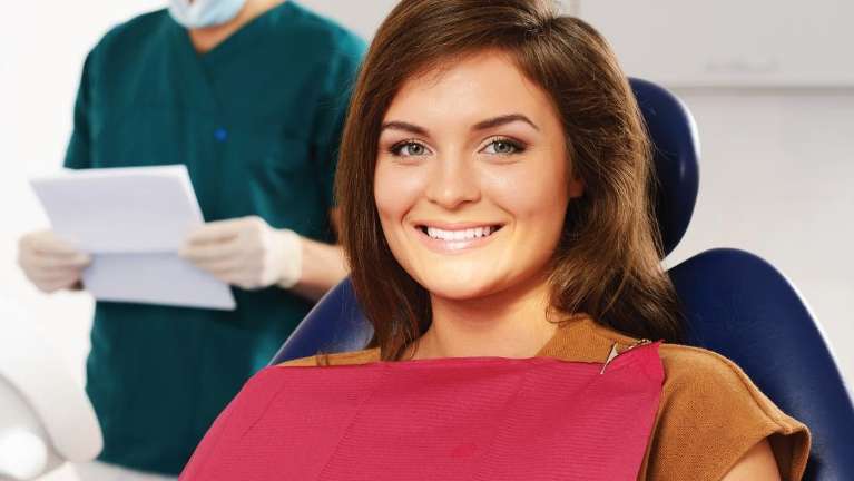 Woman smiling before dental cleaning in Rockville, MD