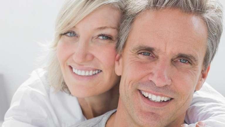 Husband and wife wearing dental implants in Rockville MD