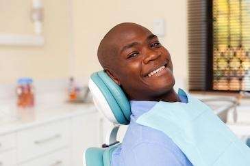 man sitting in a dental chair