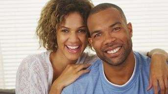 young couple hugging | tooth extraction rockville md