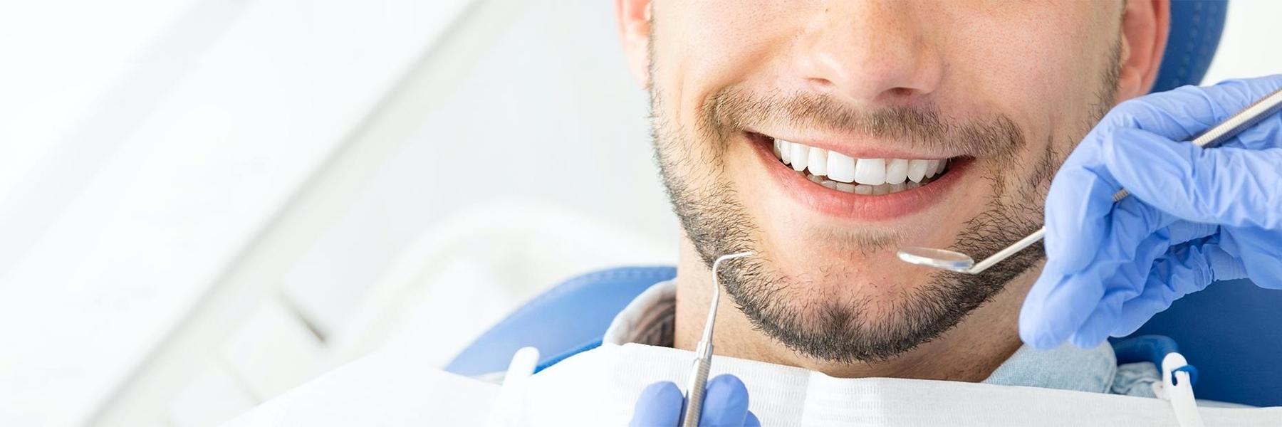 Patients smile after root canal treatment in Rockville MD