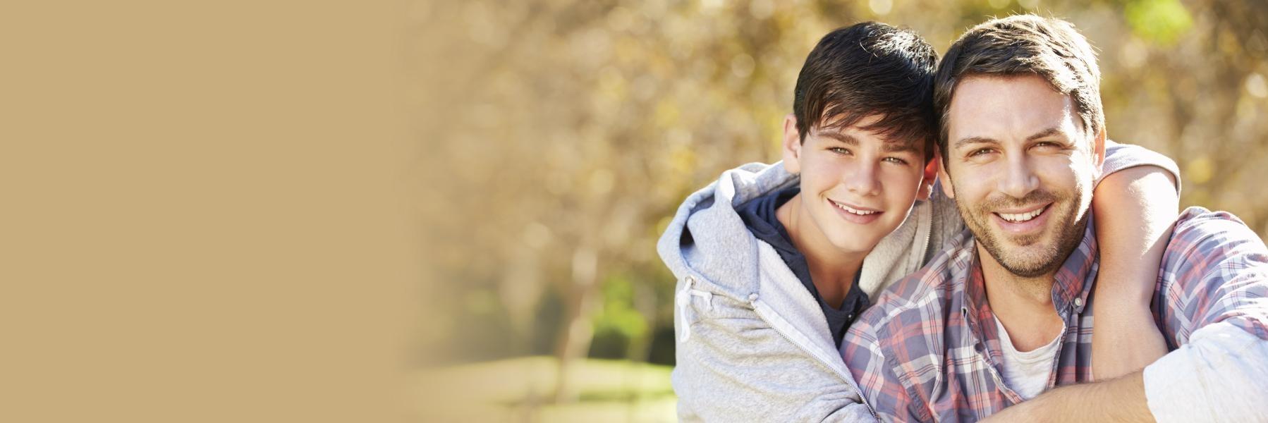 Father and son smiling at Mattie J.T. Stepanek Park in Rockville, MD
